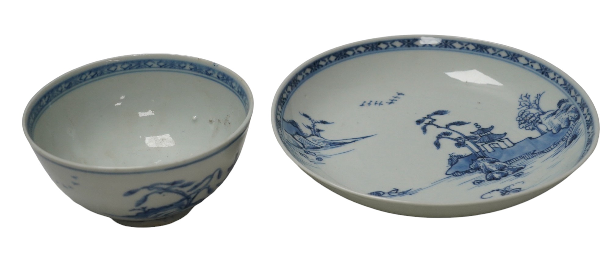 A large Chinese Nanking cargo blue and white tea bowl and saucer, saucer 17.5cm. Condition - good